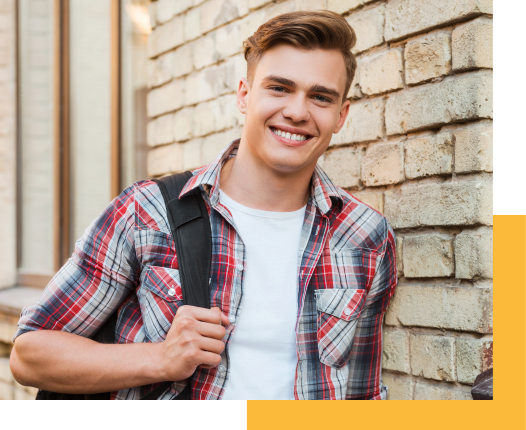 Male student against wall