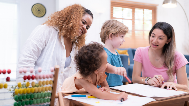 A photo of two female early childhood teachers